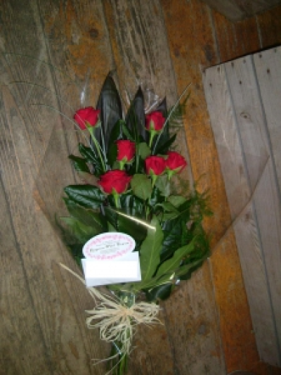 Six Red Roses - Red Roses with wax flowers. Delivery not included during valentines please ask florist for prices